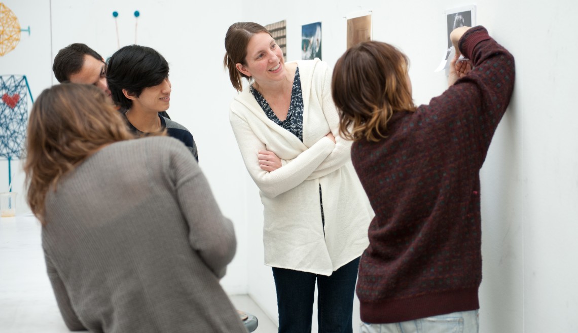 Camille Utterback, center, conducts a critique of a project with her class.