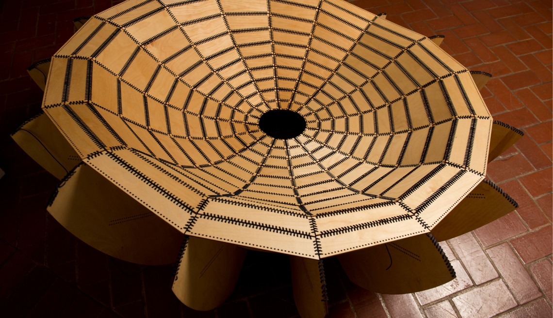 Mariel Lanas's 'Tile Chair,' which is made of laser-cut Baltic birch plywood and nylon line, looks fragile but is surprisingly strong.