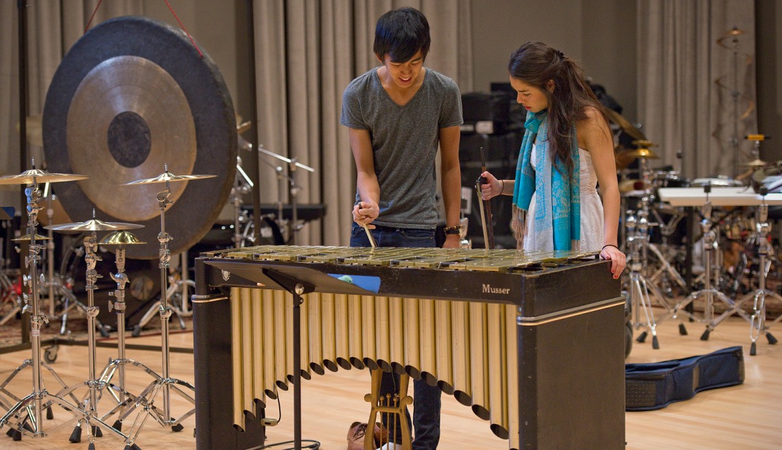 Sophomore Kenneth Qin and Junior Tina Miller experiment with the use of a violin bow on the bars of the vibraphone.
