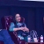 Three people seating on stage in conversation.
