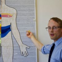 Mixed-media mosaics of the human body, inspired by Frankenstein