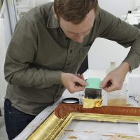 Gilded frames enhance paintings from the Gilded Age at the Cantor Arts Center