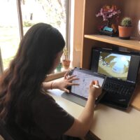 A sneak peek at Lisa’s workspace in her dorm room as she works on inking a page of her comic on her iPad.