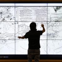 A student checks out an interactive map at the David Rumsey Map Center. Understanding new data-driven methods for storing and accessing cultural records is among the new study options at Stanford that combine data science with the humanities and arts. | LiPo Ching for Stanford University