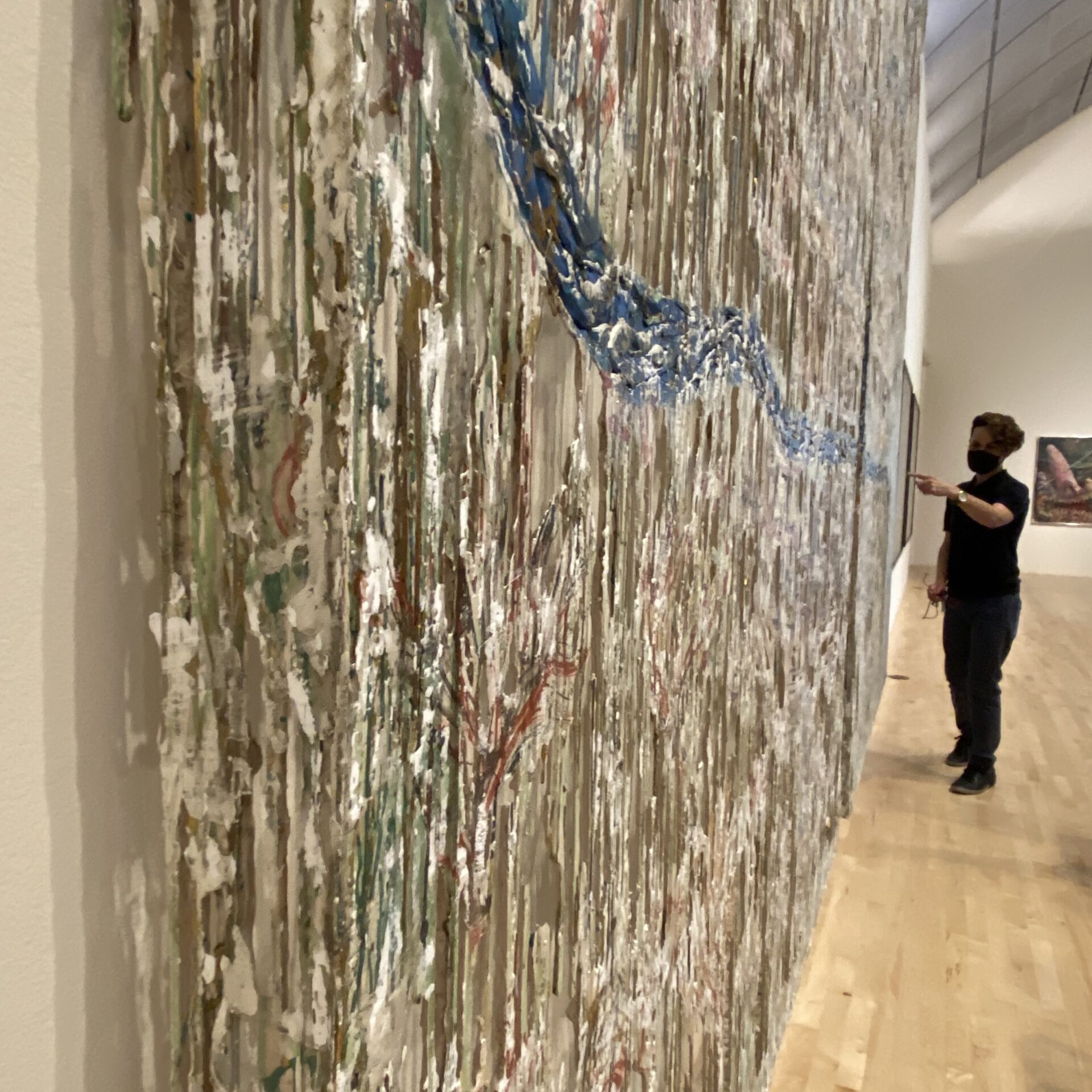 an instructor pointing to an abstract expressionist painting