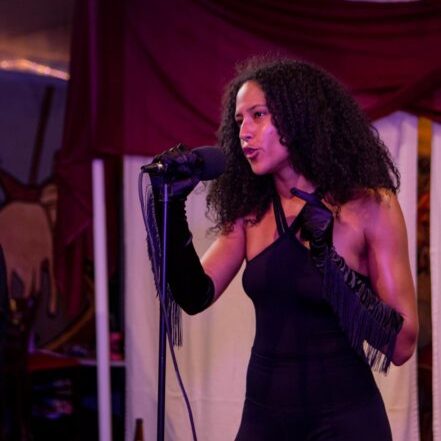 a person standing in front of a microphone